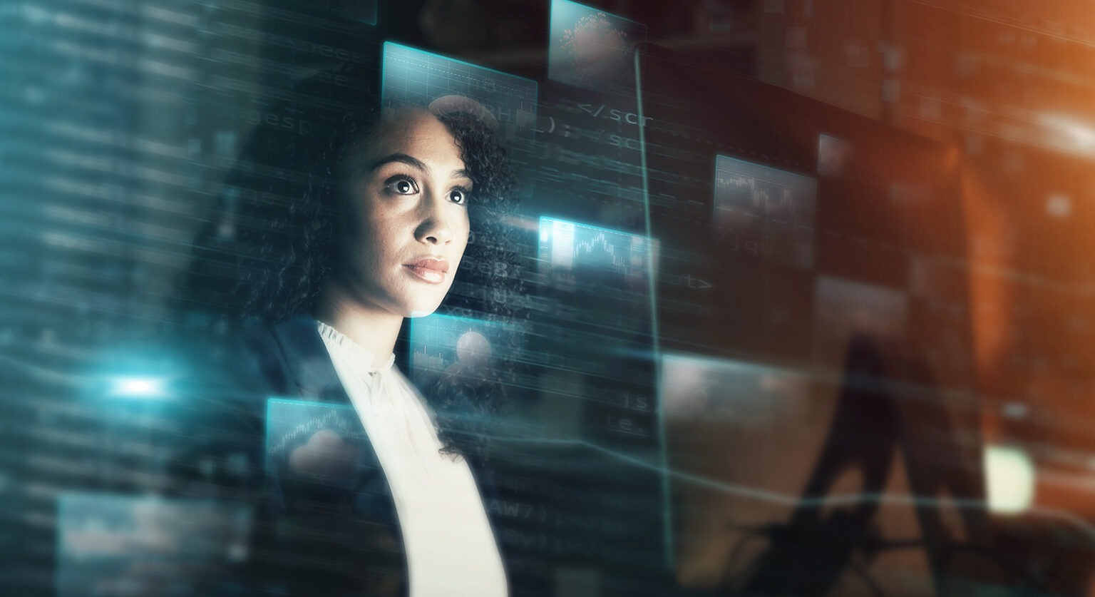 A woman looking through glass at AI programmes reflected on it