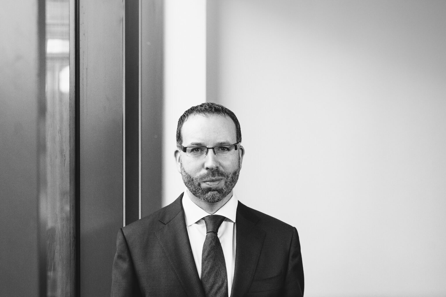 A black-and-white professional portrait photo of Joe Carroll, Head of Professional Development with Chartered Accountants Ireland.